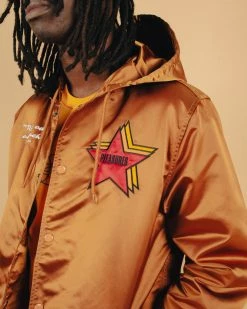 NEW ARRIVALS PLEASURES BERLIN SATIN COACHES JACKET CARAMEL