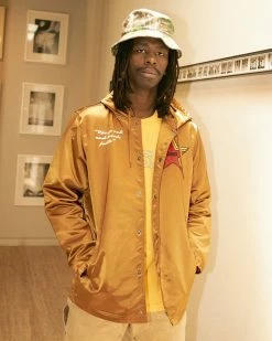 NEW ARRIVALS PLEASURES BERLIN SATIN COACHES JACKET CARAMEL